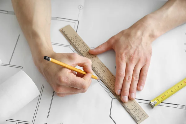 Man working with blueprints — Stock Photo, Image