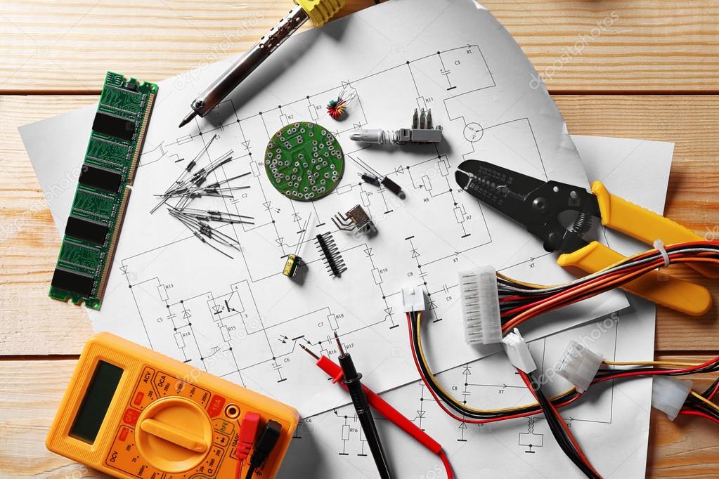 Electronic components on drawings Stock Photo by ©belchonock 115280548