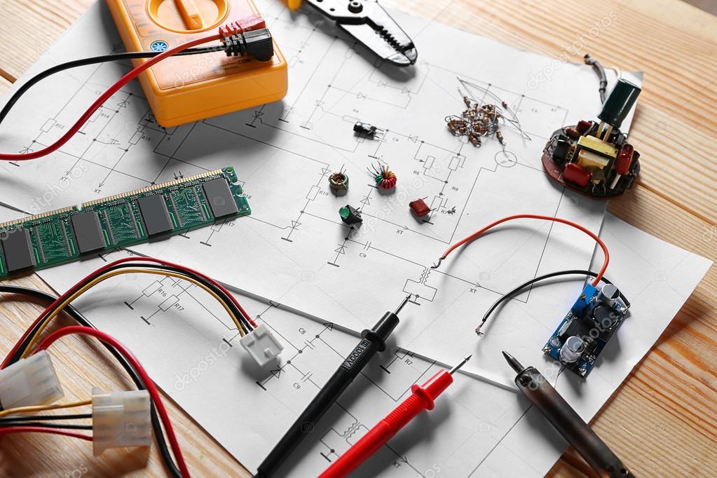Electronic components on drawings Stock Photo by ©belchonock 115280582