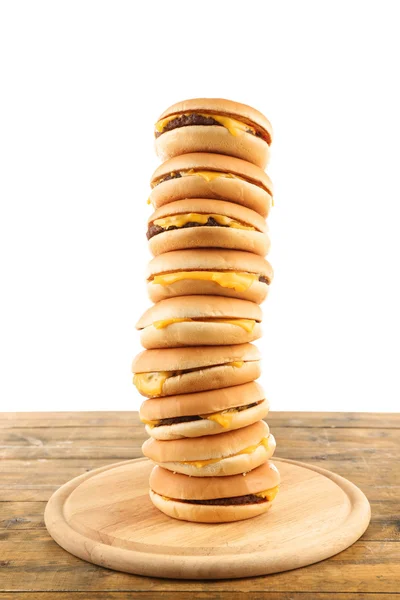 Tasty cheeseburgers on cutting board — Stock Photo, Image