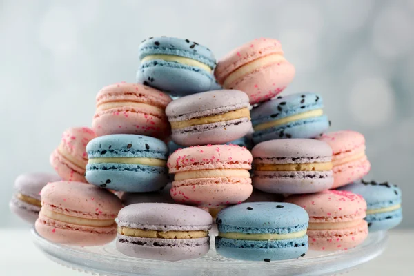 Tasty macaroons on stand — Stock Photo, Image