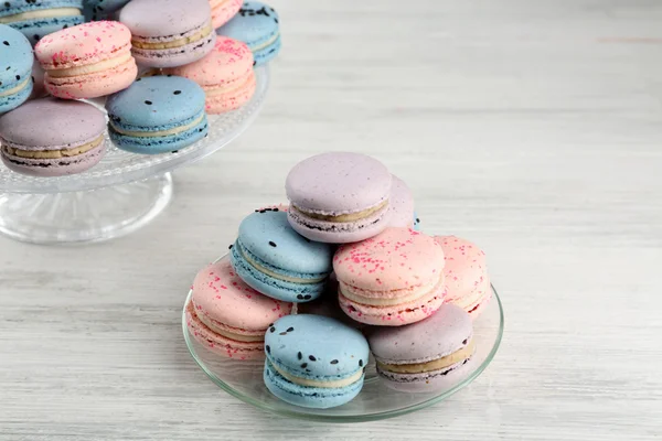 Tasty macaroons on stand — Stock Photo, Image