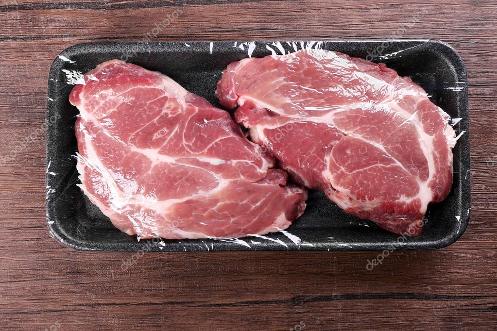 Photo piece of meat Packed pieces of meat — Stock Photo © belchonock