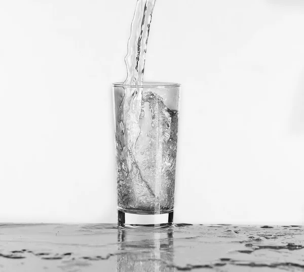 Pouring water into glass — Stock Photo, Image