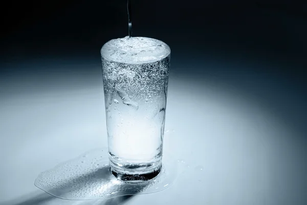 Pouring water into glass — Stock Photo, Image