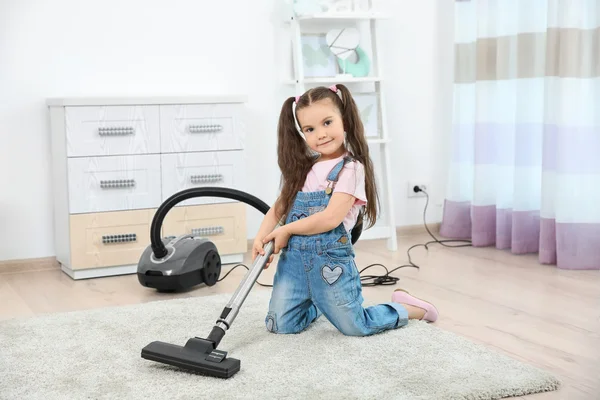 Girl using vacuum cleaner — Stock Photo, Image