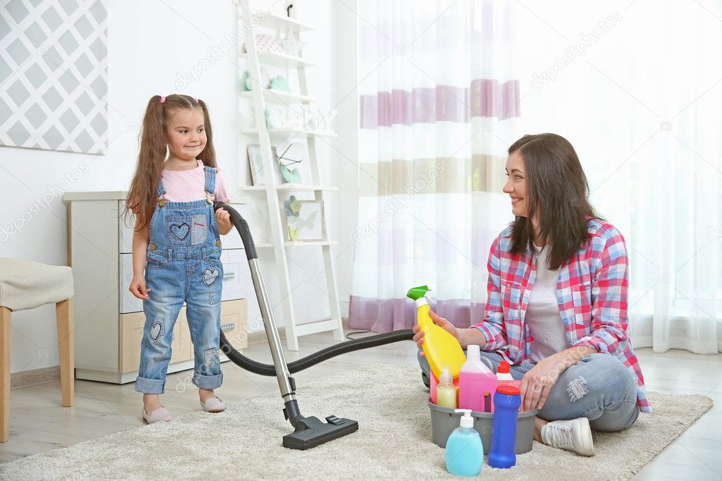 Daughter and mother cleaning house together