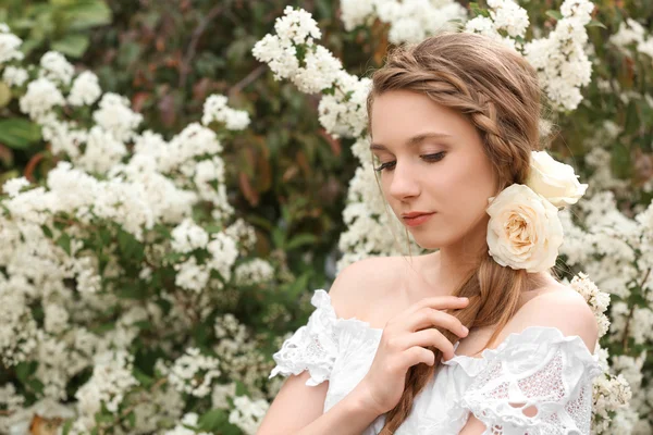 Young beautiful bride in the garden — Stock Photo, Image