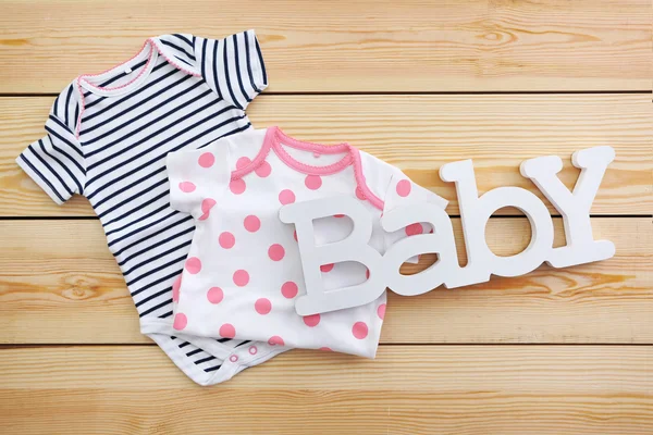 Word baby with clothes — Stock Photo, Image