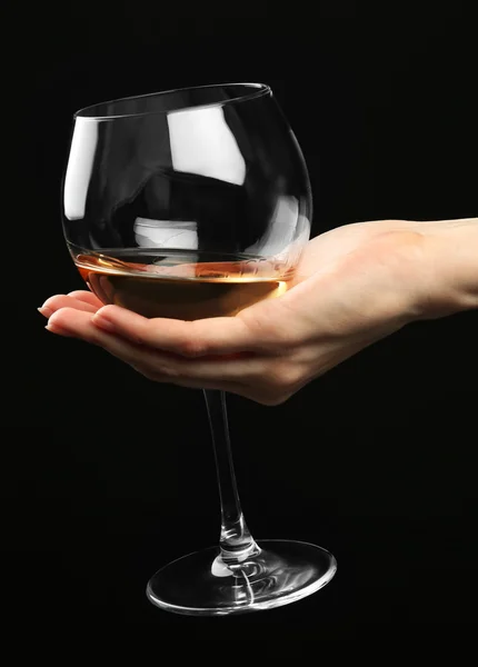 Female hand holding glass of champagne — Stock Photo, Image