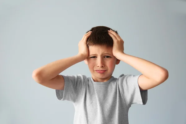 Portrait of upset boy with hands on a head — Stock Photo, Image