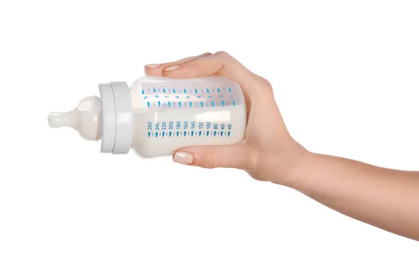 Hand holding a baby bottle of milk — Stock Photo, Image