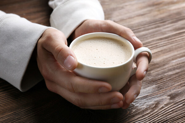 Man holding in hands cup of coffee 