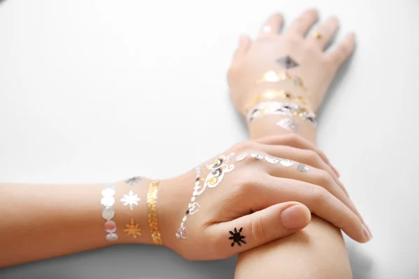 Silver and golden flash tattoo — Stock Photo, Image