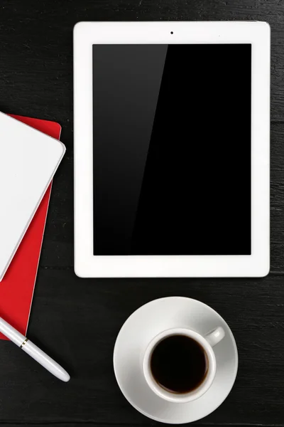 Digital tablet with cup of coffee and notebook — Stock Photo, Image