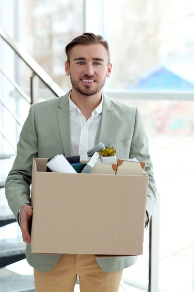 Businessman with moving box — Stock Photo, Image