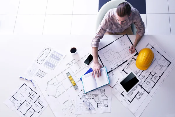 Architect working with blueprints — Stock Photo, Image