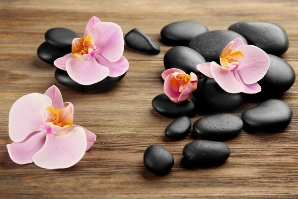 Spa stones and orchid flowers — Stock Photo, Image