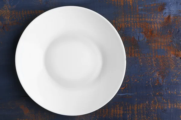 Empty plate on wooden background — Stock Photo, Image