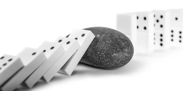 Dominoes with grey rock — Stock Photo, Image