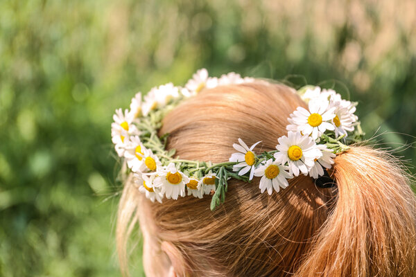 Girl with chamomile wreath