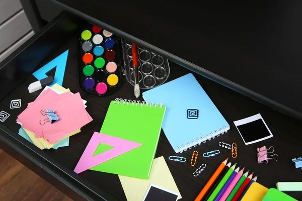 Stationery in open desk drawer — Stock Photo, Image