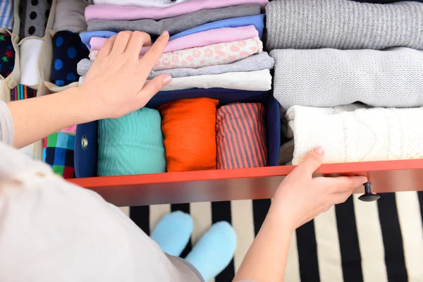 Woman folding clothes — Stock Photo, Image