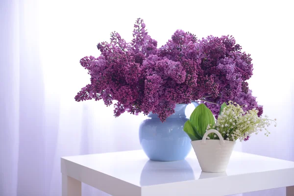 Lilac and may-lily bouquets — Stock Photo, Image