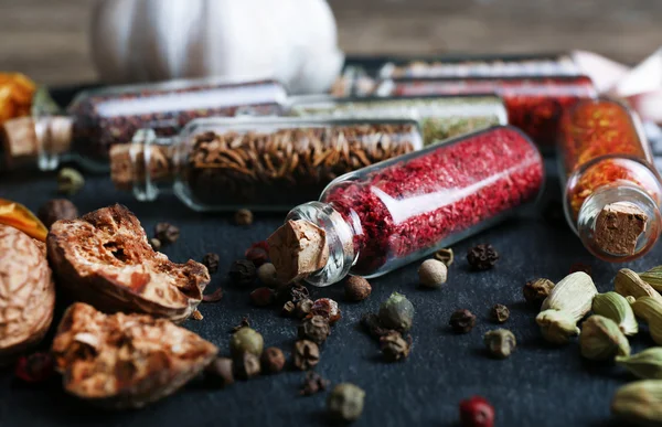 Spices in small glass bottles — Stock Photo, Image
