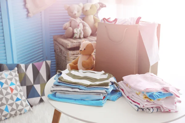 Piles of baby clothes — Stock Photo, Image