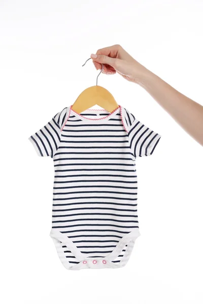 Hand met baby Romper — Stockfoto