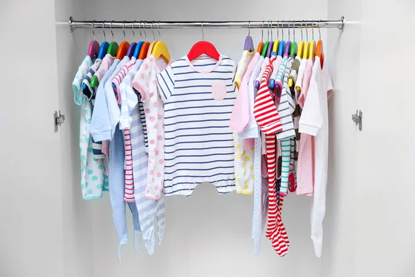 Clothes for kids in wardrobe — Stock Photo, Image