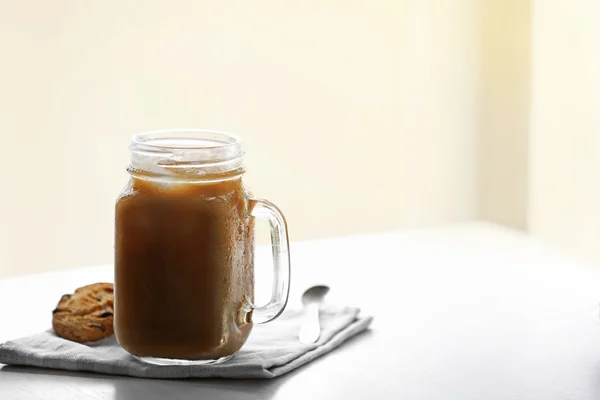 Iced coffee in glass jar — Stock Photo, Image