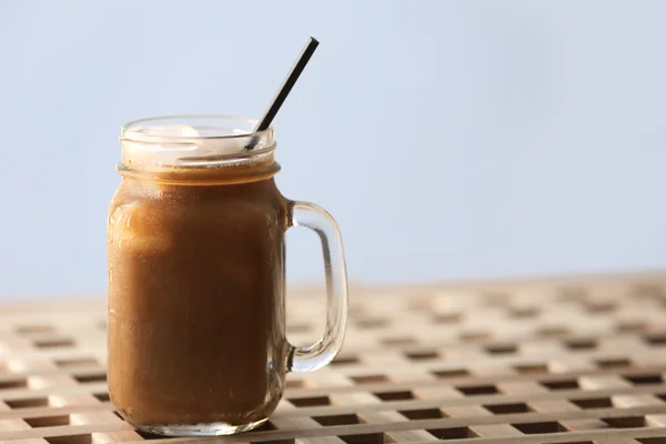 Iced coffee in glass jar — Stock Photo, Image