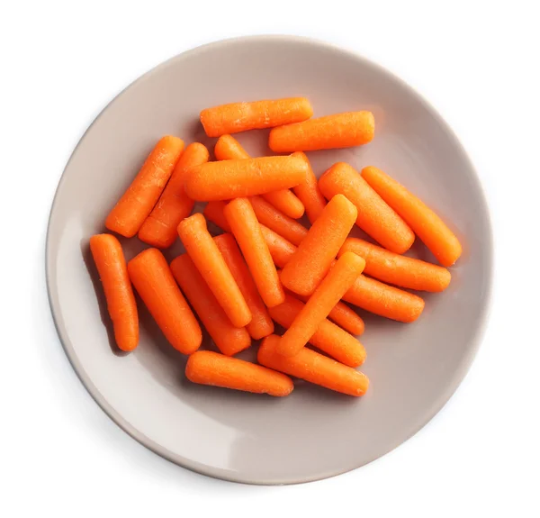 Маленька морква в тарілці — стокове фото