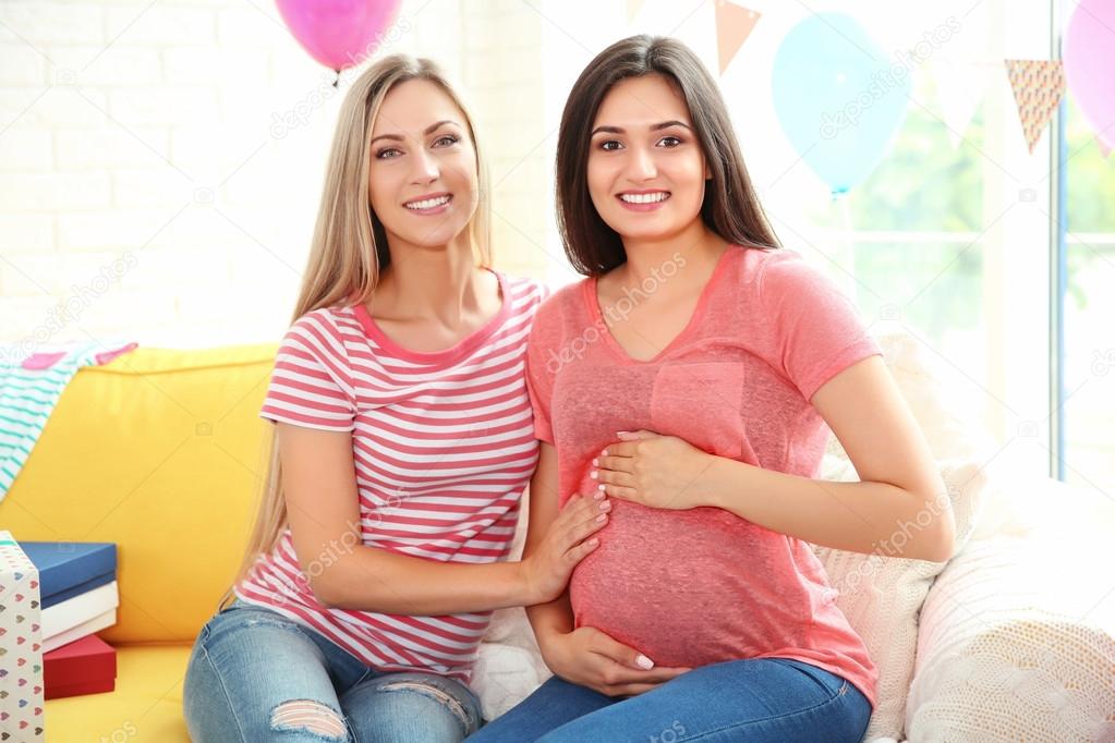 Pregnant woman and friend at baby shower party — Stock ...