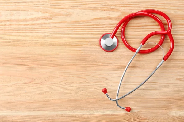 Červené stetoskop na stole — Stock fotografie