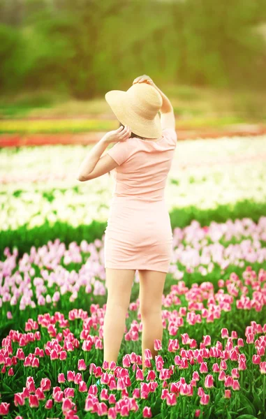 Happy woman on blooming field — Stock Photo, Image