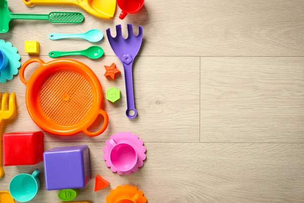 Children toys on wooden floor . Flat lay — Stock Photo, Image