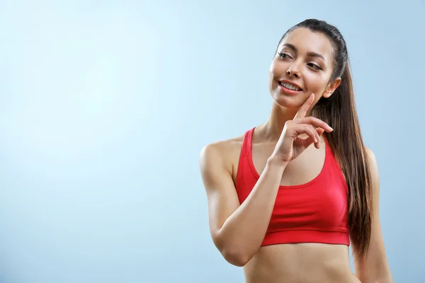 Aantrekkelijke fitness vrouw denken — Stockfoto