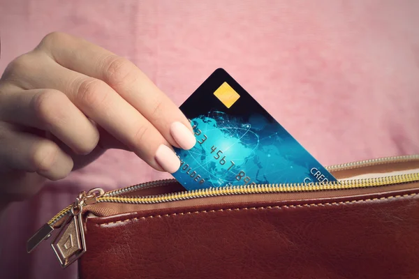 Hand putting credit card — Stock Photo, Image