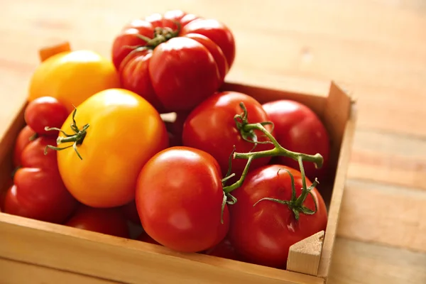 Different tomatoes in box — Stock Photo, Image