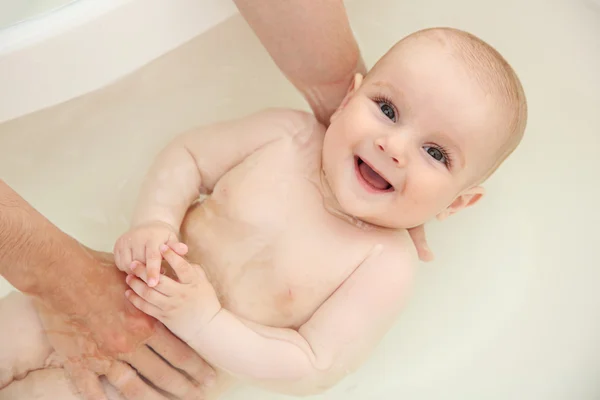 Cute baby bathing Stock Photo