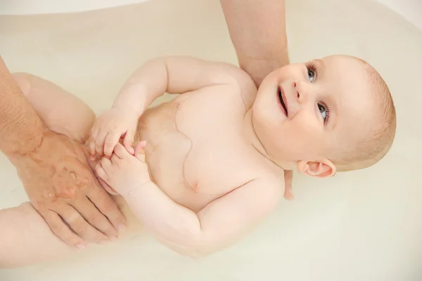 Cute baby bathing Royalty Free Stock Images