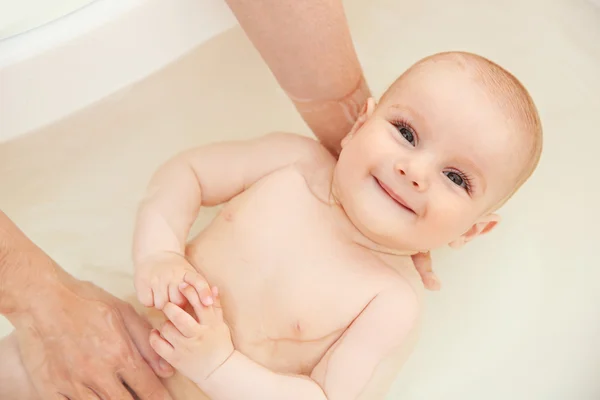 Cute baby bathing Royalty Free Stock Images