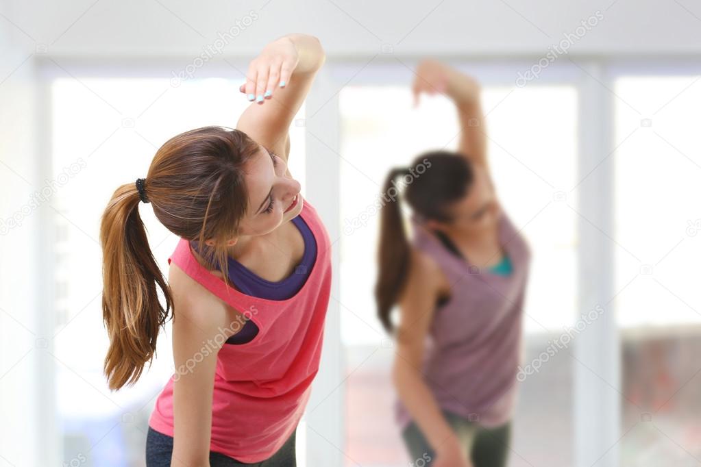 young woman doing exercises 