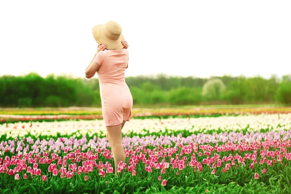 Woman on blooming field — Stock Photo, Image