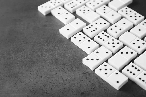 Heap of dominoes on grey — Stock Photo, Image