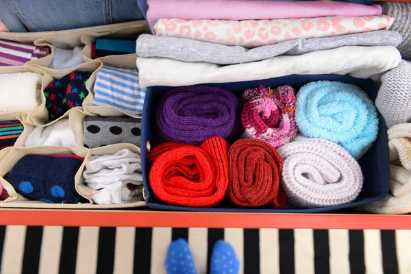 Folded clothes in chest of drawers — Stock Photo, Image