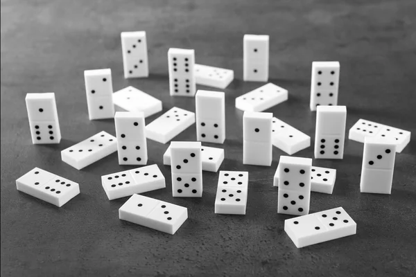 Heap of dominoes on grey — Stock Photo, Image